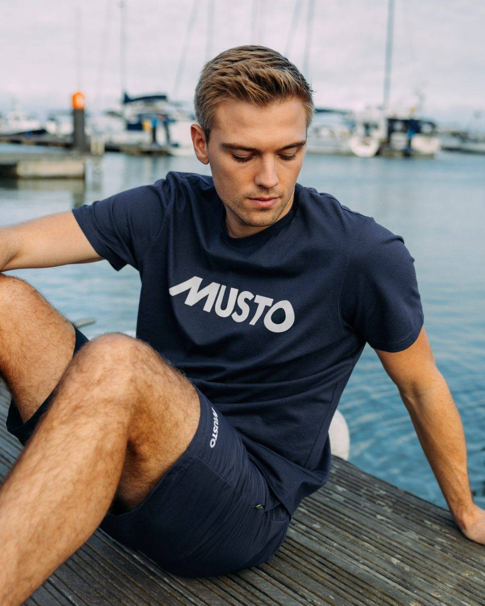 Navy Coloured Musto Logo Tee On A White Background