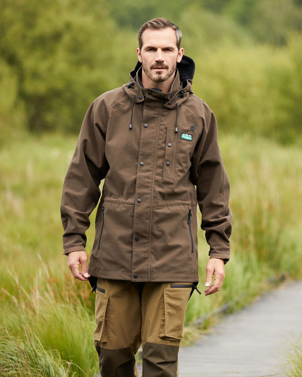 Bark Coloured Ridgeline Monsoon Classic Jacket On A Forest Background
