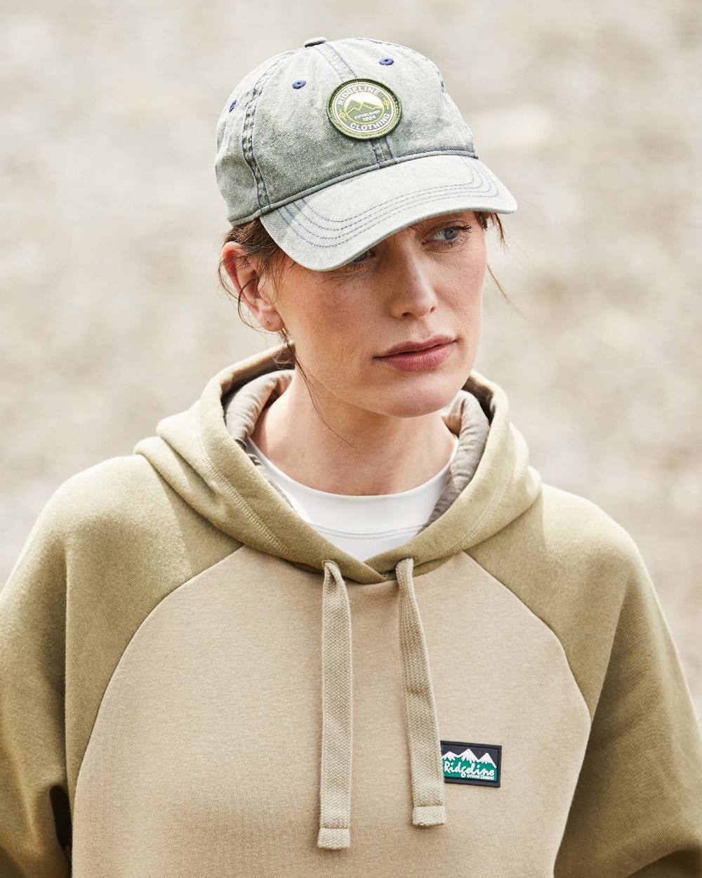 Olive Wash Coloured Ridgeline Original Truckie Cap On A Blurry Background