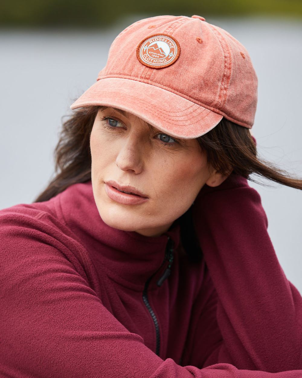 Russet Wash Coloured Ridgeline Original Truckie Cap On A Blurry Background