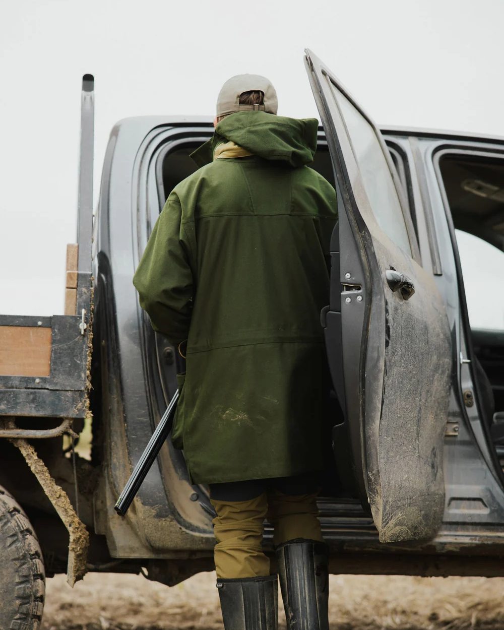 Olive Coloured Swazi Wapiti Xp Jacket On A Forest Background