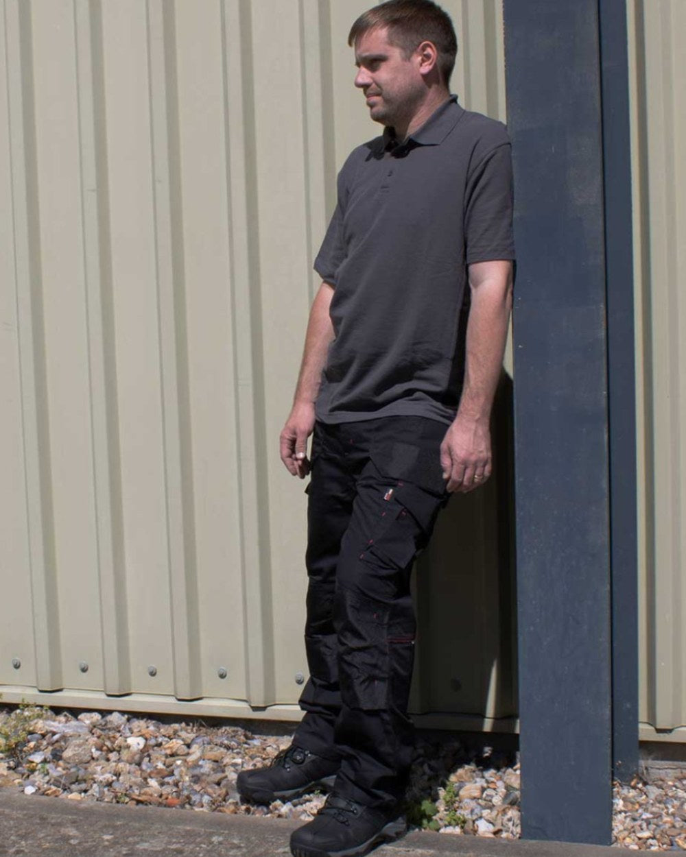 Black Coloured TuffStuff Elite Work Trousers On A Street Background