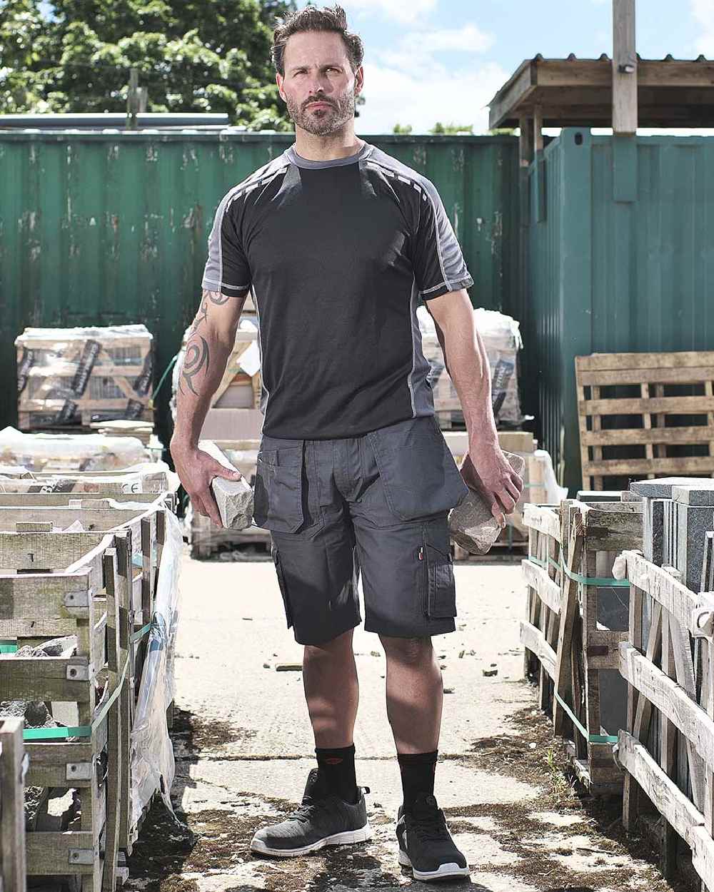 Grey Coloured TuffStuff Enduro Work Shorts On A Warehouse Background