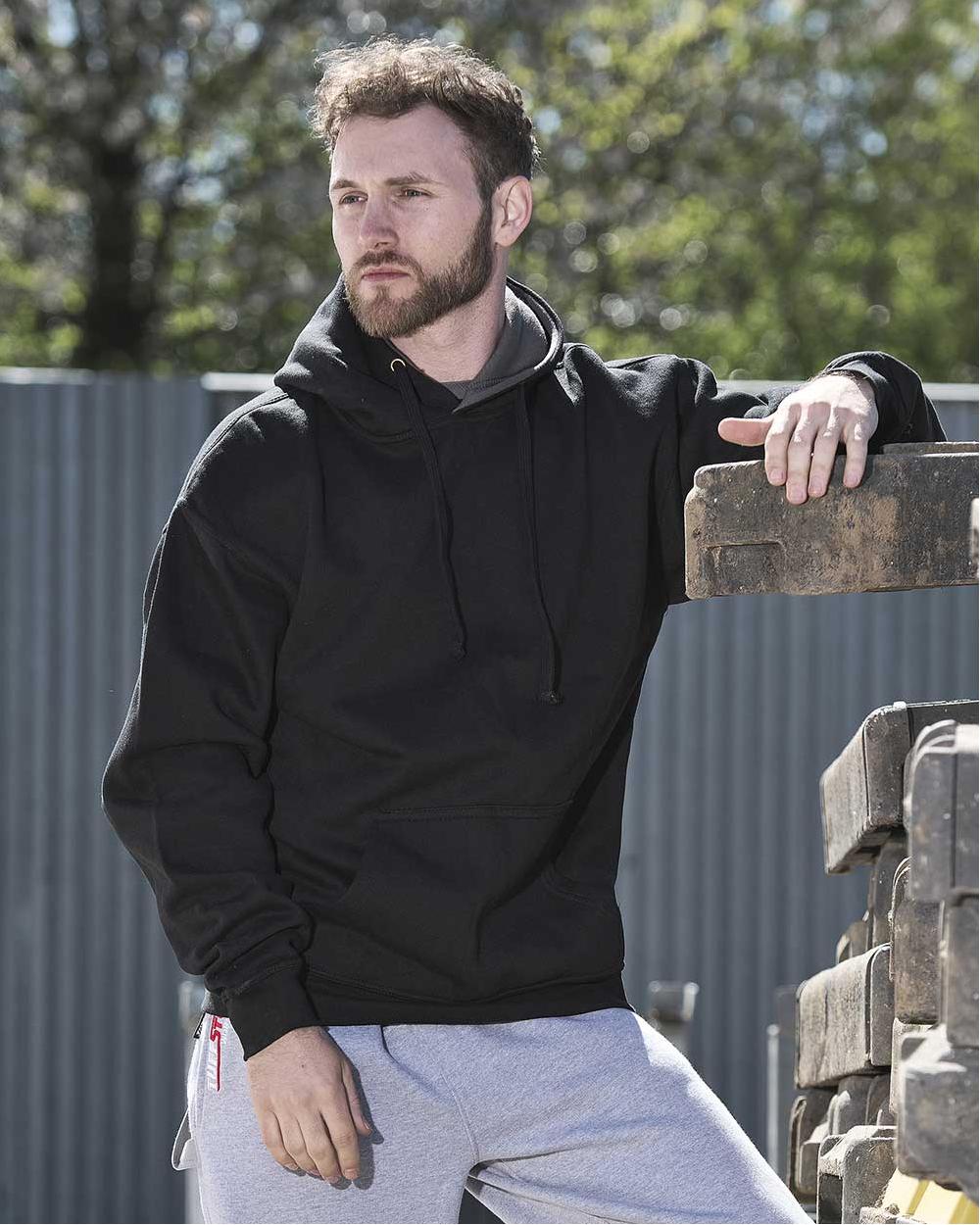 Black Coloured TuffStuff Hendon Hoodie On A Warehouse Background