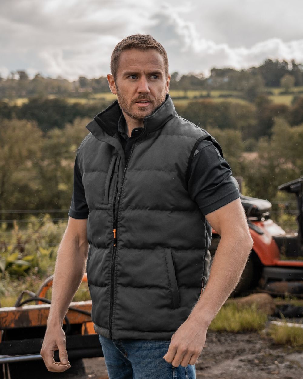 Grey Coloured Xpert Mens Core Padded Work Bodywarmer on Outdoor Background