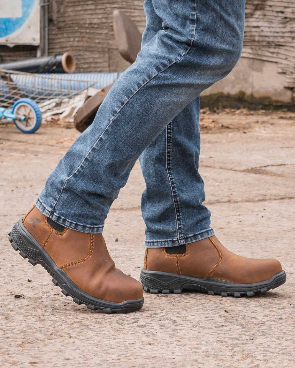 Brown coloured Xpert Mens Heritage Rancher Non-Safety Boots on Outdoor Background