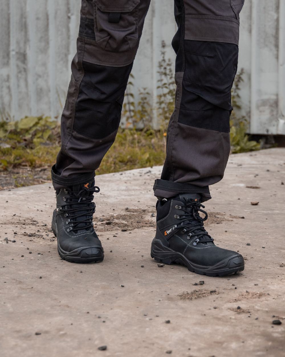 Black Coloured Xpert Mens Typhoon Waterproof Safety Boots on Outdoor Background