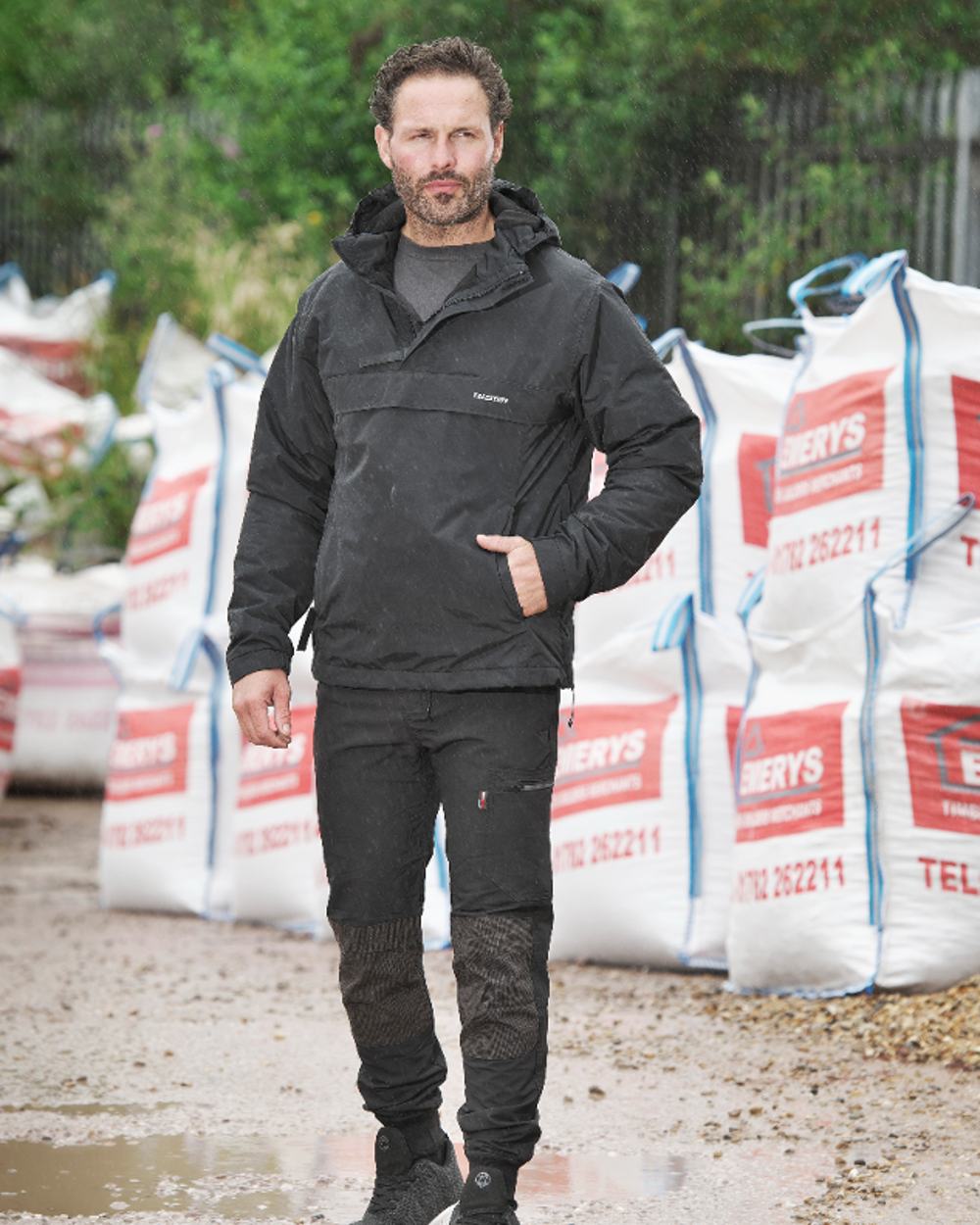 Black Coloured TuffStuff Sutherland Waterproof Windbreaker Smock On A Street Background