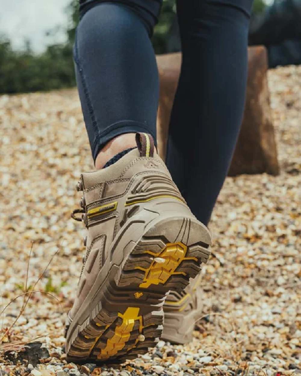 Stone coloured Amblers Safety AS965C Stone Safety Boots on tiny stones background 