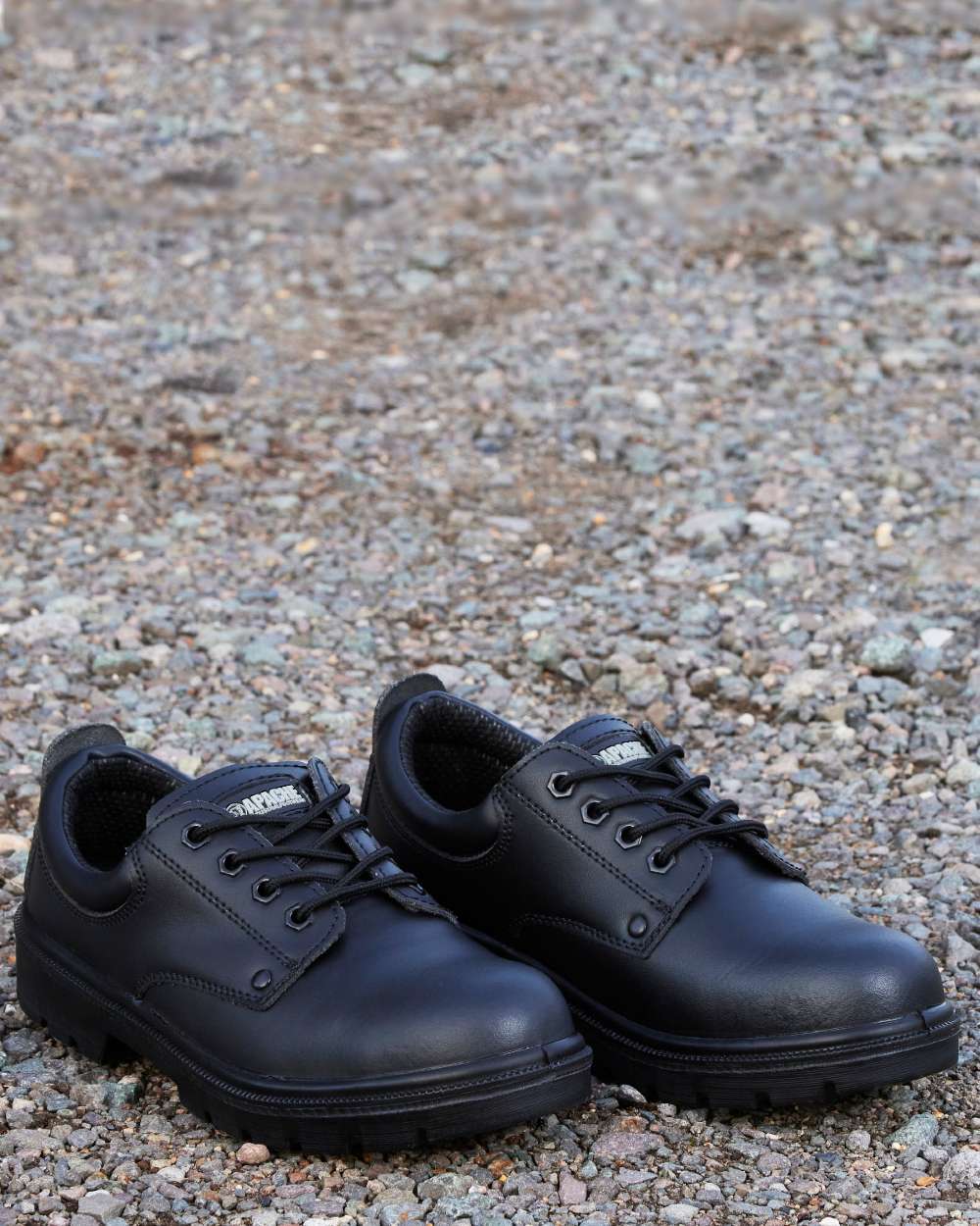Black Coloured Apache Mens 4 Eye Safety Shoes on outdoor background 
