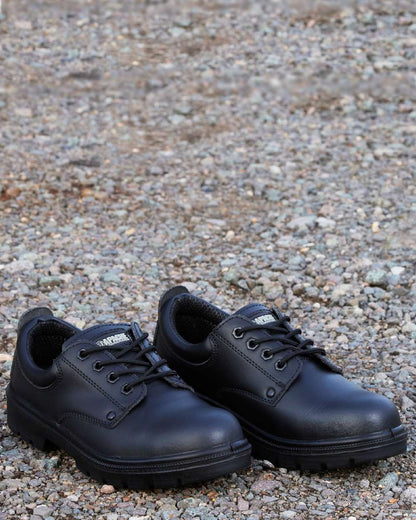 Black Coloured Apache Mens 4 Eye Safety Shoes on outdoor background 