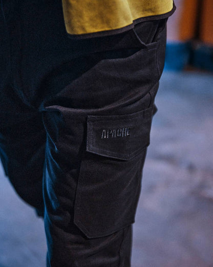 Black Coloured Apache Mens Barkerville Cargo Trousers on warehouse background 