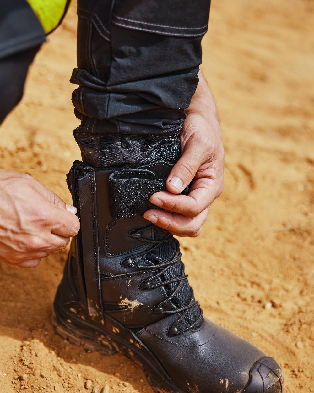Black Coloured Apache Mens Combat High Leg Waterproof Safety Boots on outdoor background 