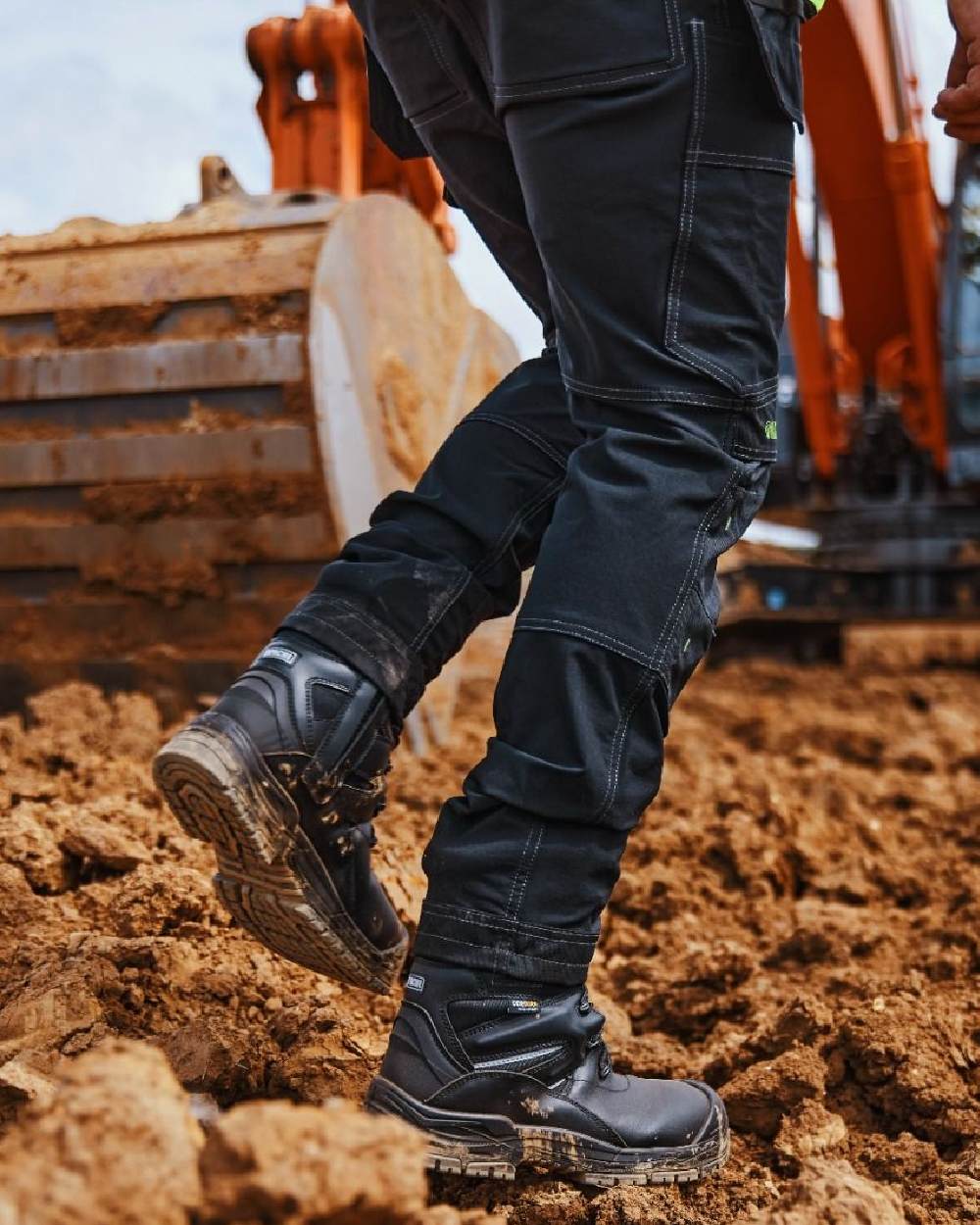 Black Coloured Apache Mens Combat High Leg Waterproof Safety Boots on outdoor background 