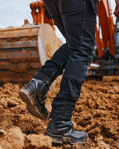 Black Coloured Apache Mens Combat High Leg Waterproof Safety Boots on outdoor background 