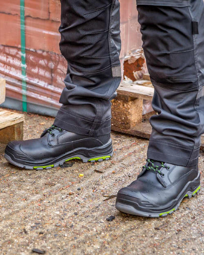 Black Coloured Apache Mens Dakota Metal Free Waterproof Safety Boots on outdoor background 