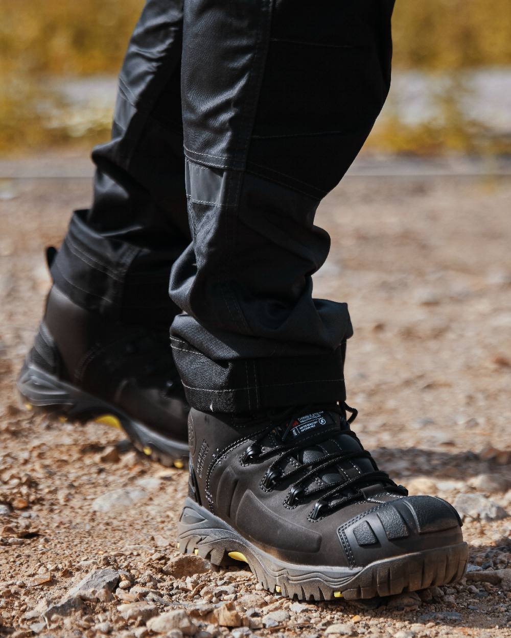 Black Coloured Apache Mens Non-Metallic Waterproof Safety Boots on outdoor background 