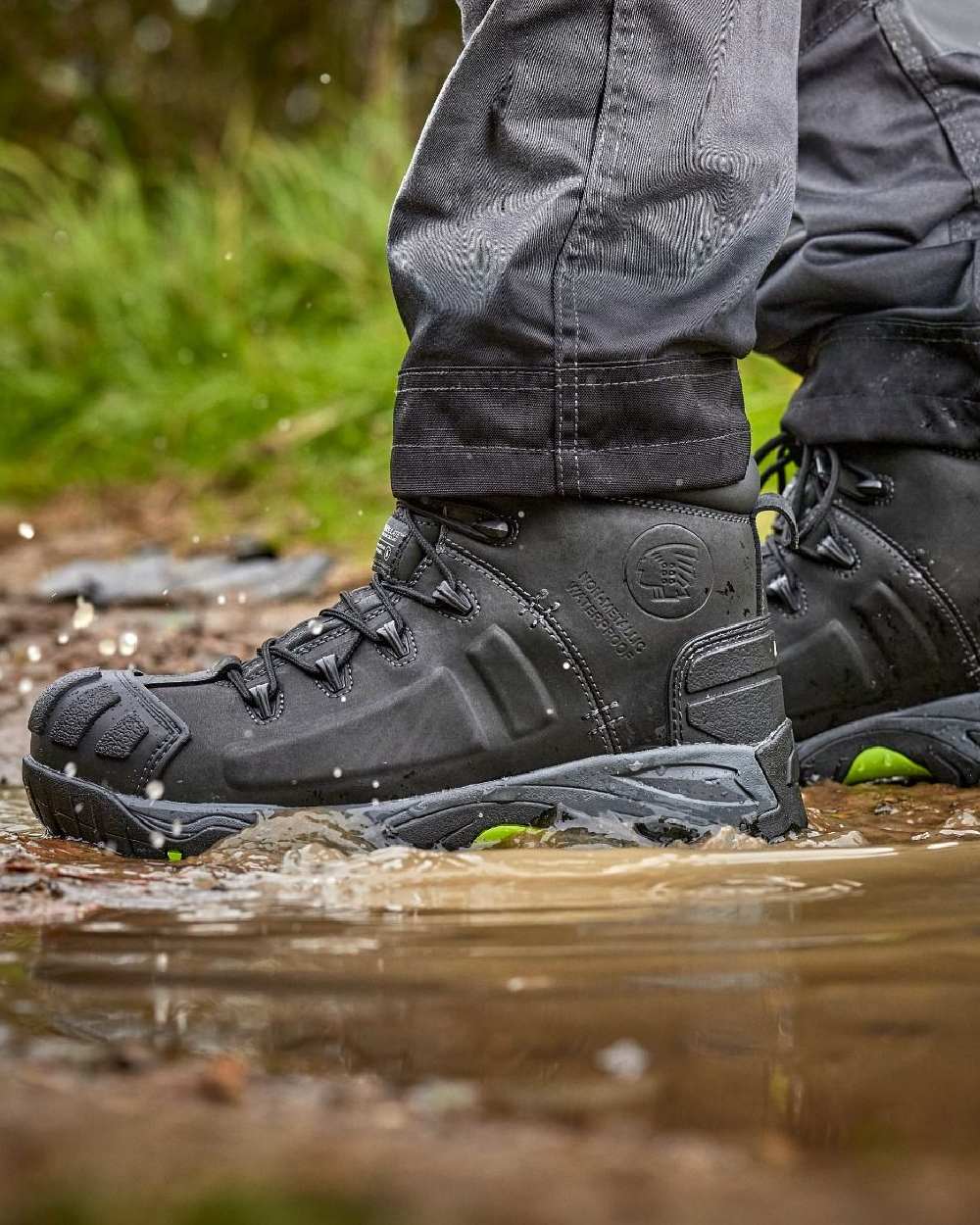 Black Coloured Apache Mens Non-Metallic Waterproof Safety Boots on outdoor background 