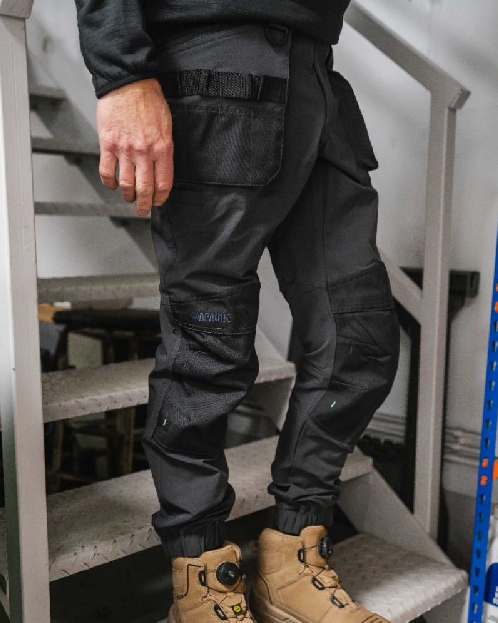 Grey Black Coloured Apache Mens Yellowknife Elasticated Hem 4 Way Stretch Trousers on office background 