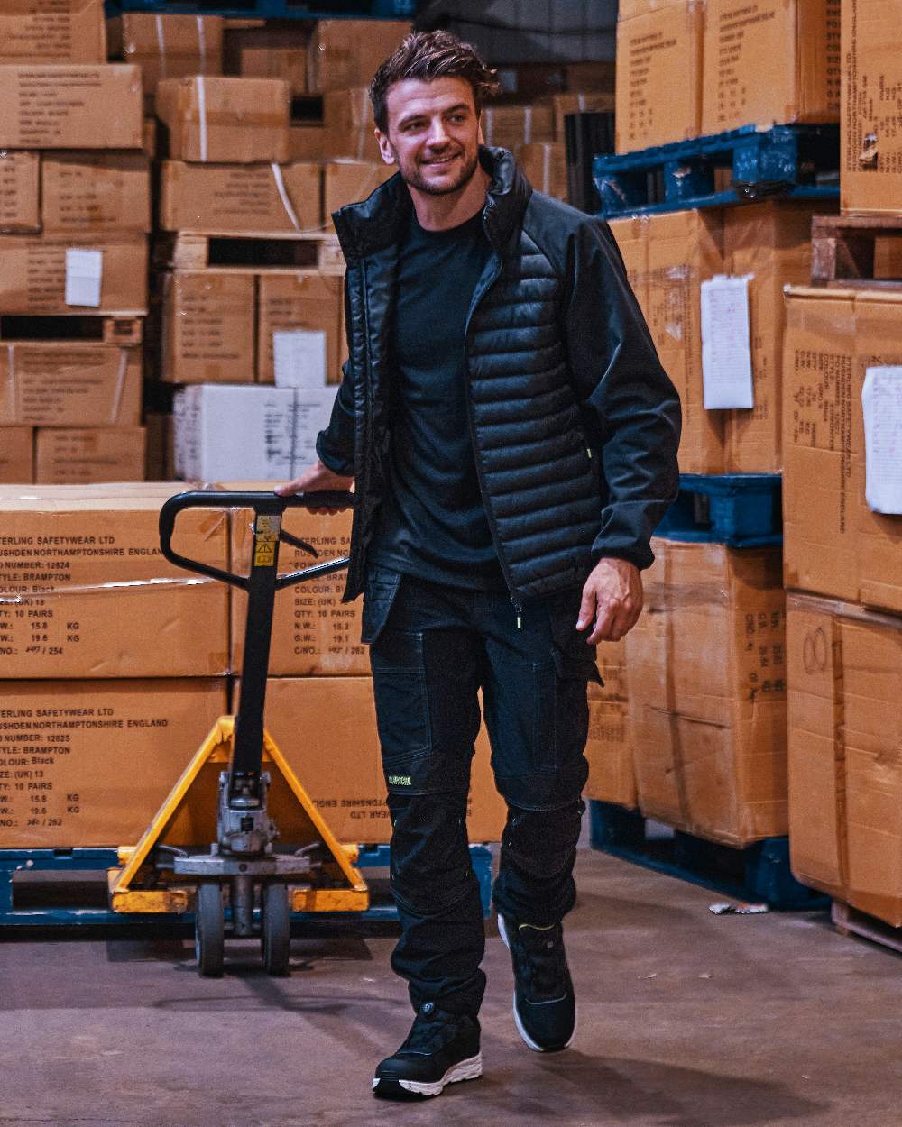 Black Coloured Apache Mens Ashcroft Hybrid Jacket on warehouse background 