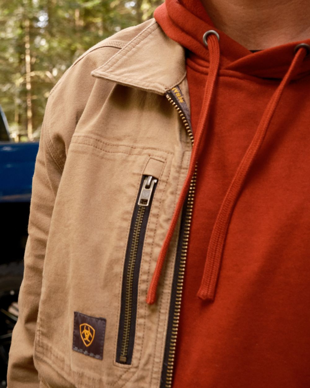 Russet Brown Potters Clay Coloured Ariat Mens Rebar Graphic Hoodie on outdoor background 