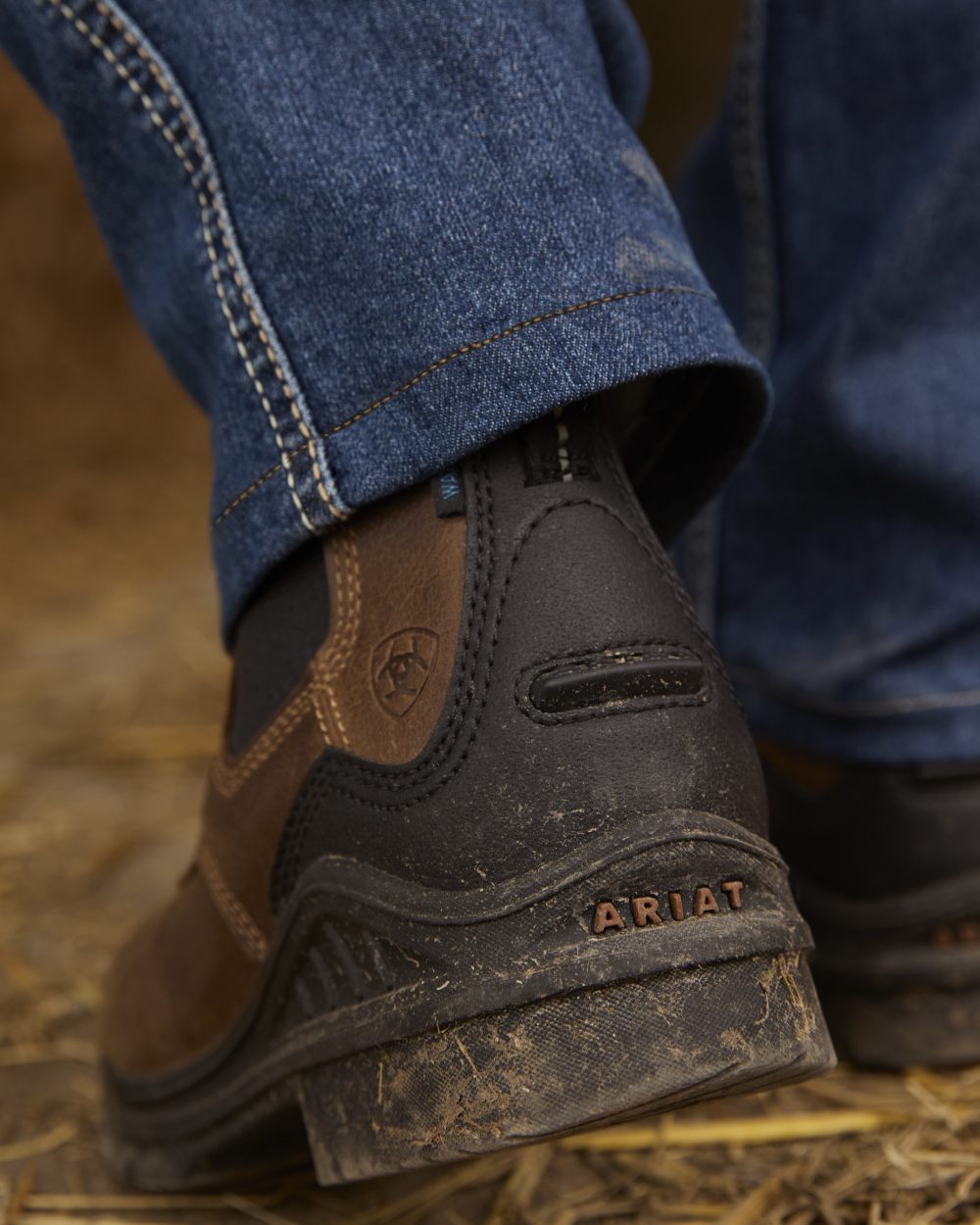 Antique Brown coloured Ariat Womens Barnyard Twin Gore II Waterproof Boot on grassy background 