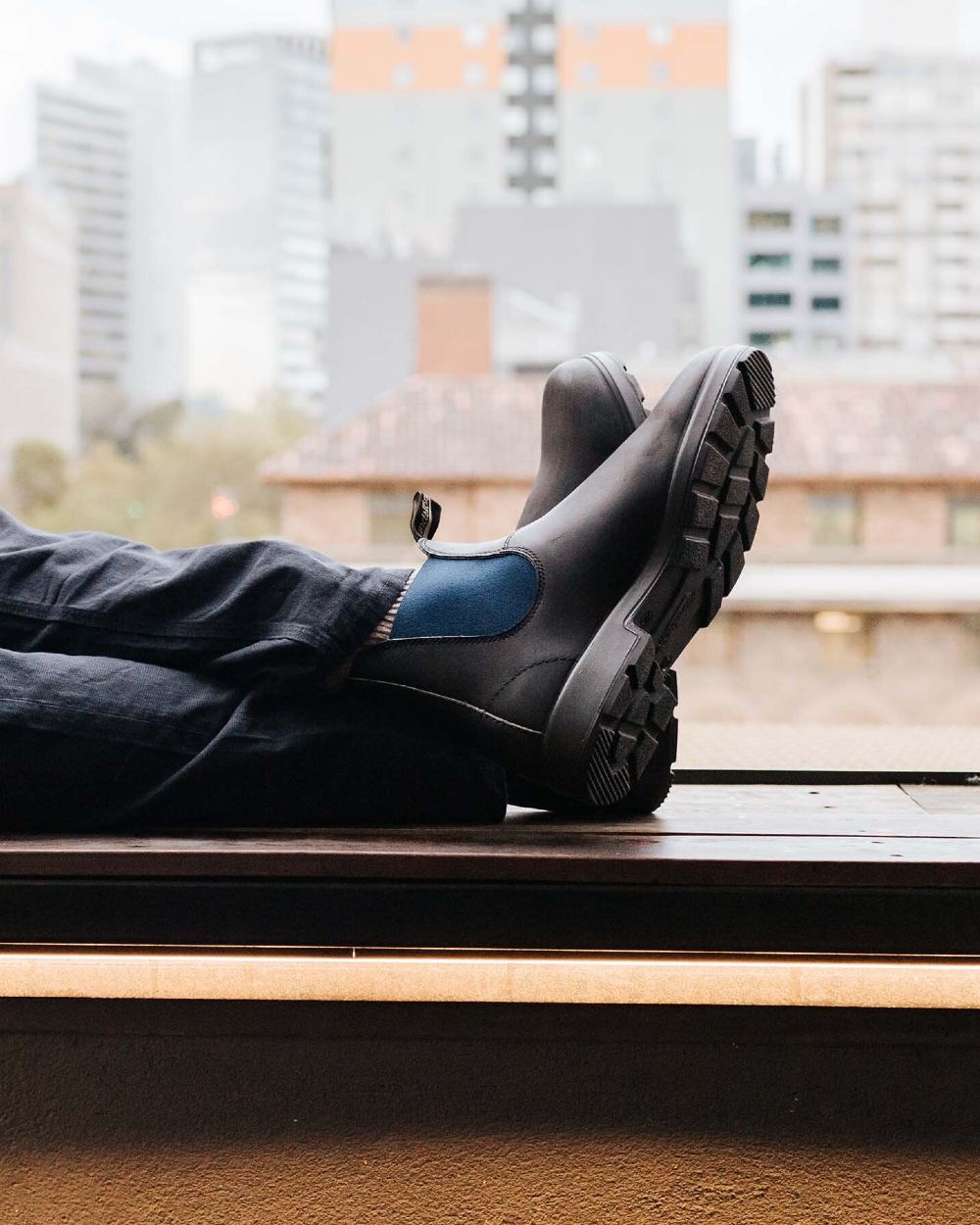 Black Navy coloured Blundstone 1917 Boots Black with Navy Elastic on window background 
