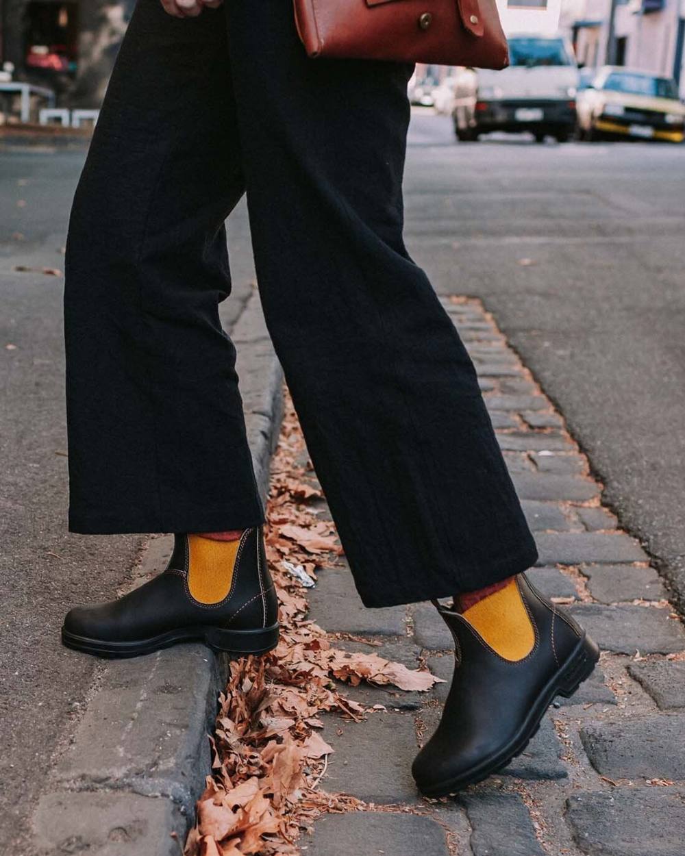 Dark Brown Mustard coloured Blundstone 1919 Dark Brown Mustard Leather Boots on street background 