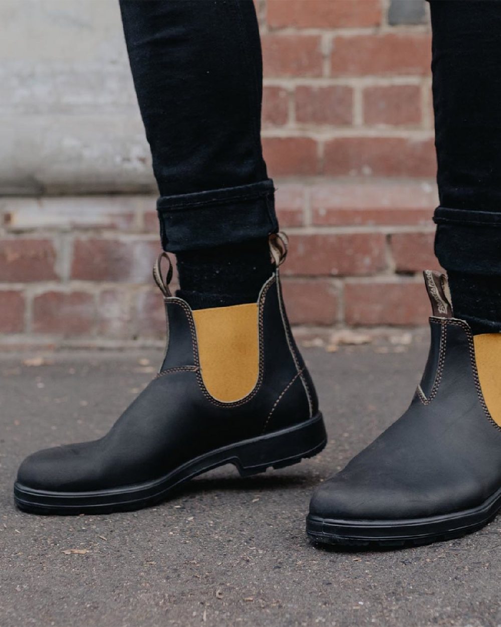 Dark Brown Mustard coloured Blundstone 1919 Dark Brown Mustard Leather Boots on street background 