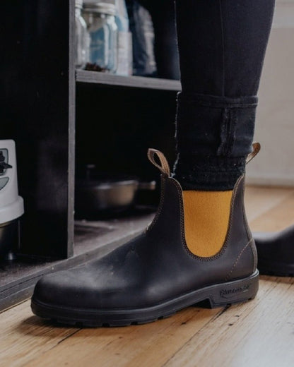 Dark Brown Mustard coloured Blundstone 1919 Dark Brown Mustard Leather Boots on floor background 