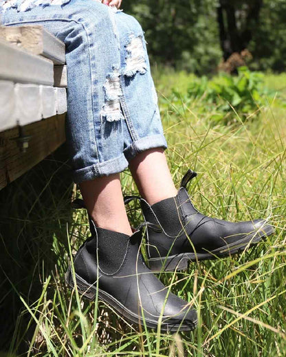 Black coloured Blundstone 510 Original Voltan Black Leather Boots on grass background 