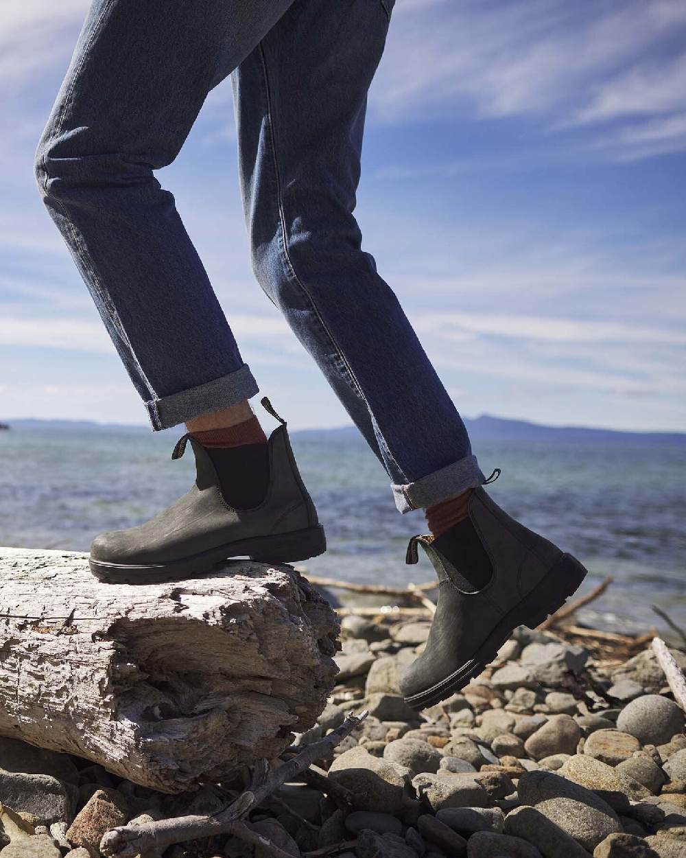 Rustic Black coloured Blundstone 587 Rustic Black Leather Boots on sea background 