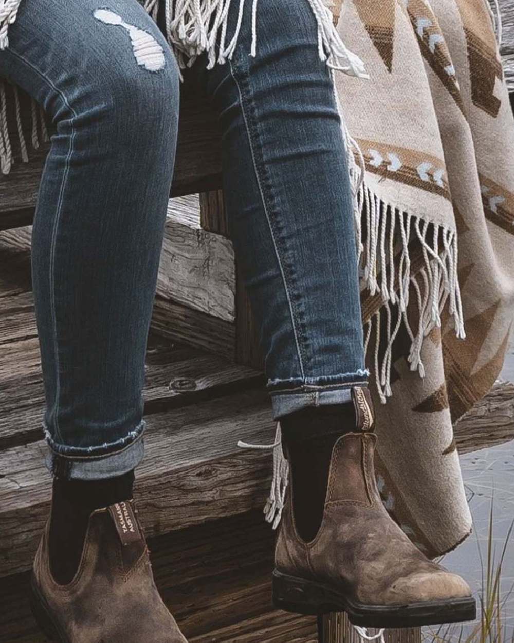 Rustic Brown coloured Blundstone Classic 585 Chelsea Boots on lake background 