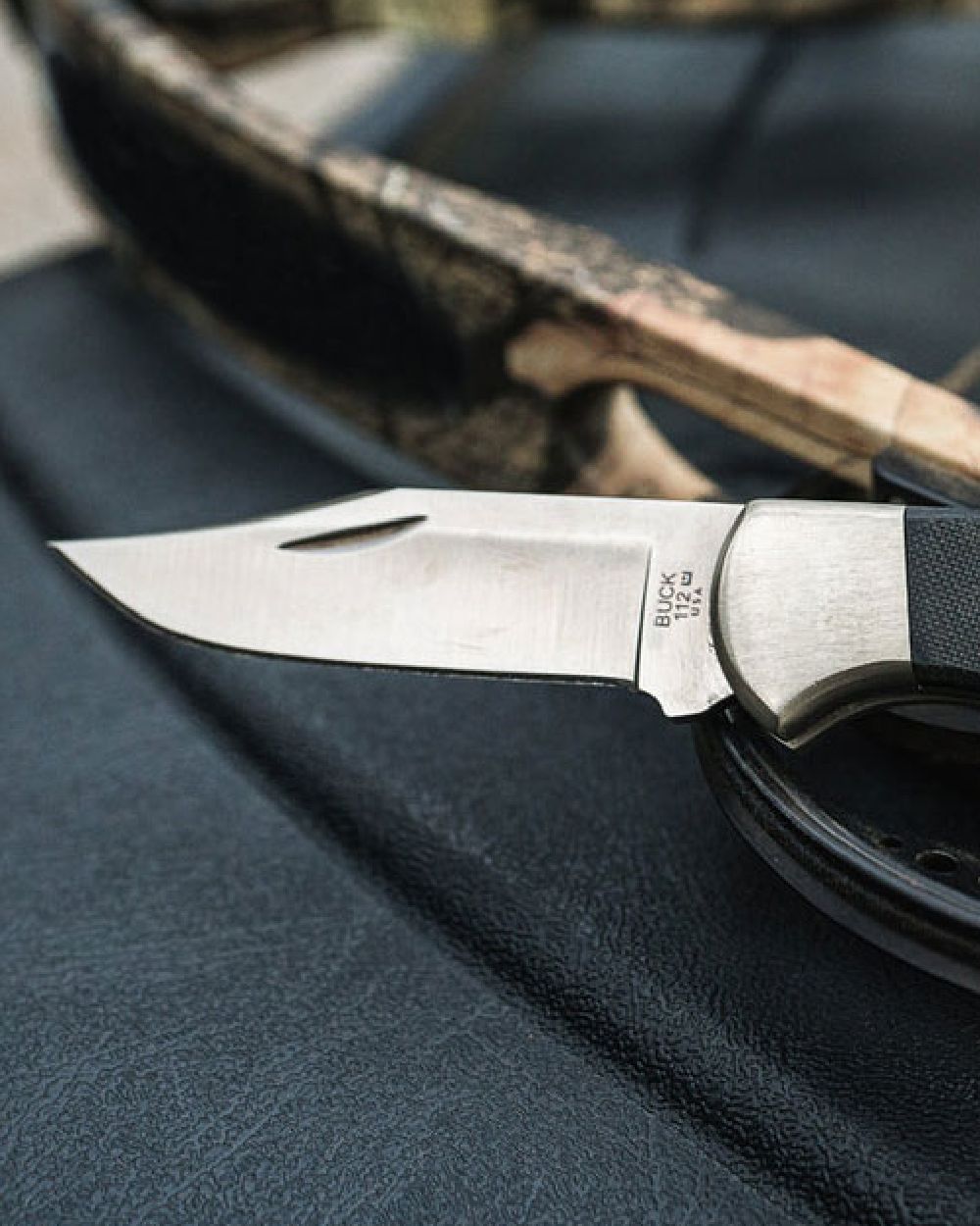 Buck Ranger Pro Knife on blurry background