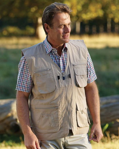 Stone coloured Champion Dale Gilet on blurry park background 