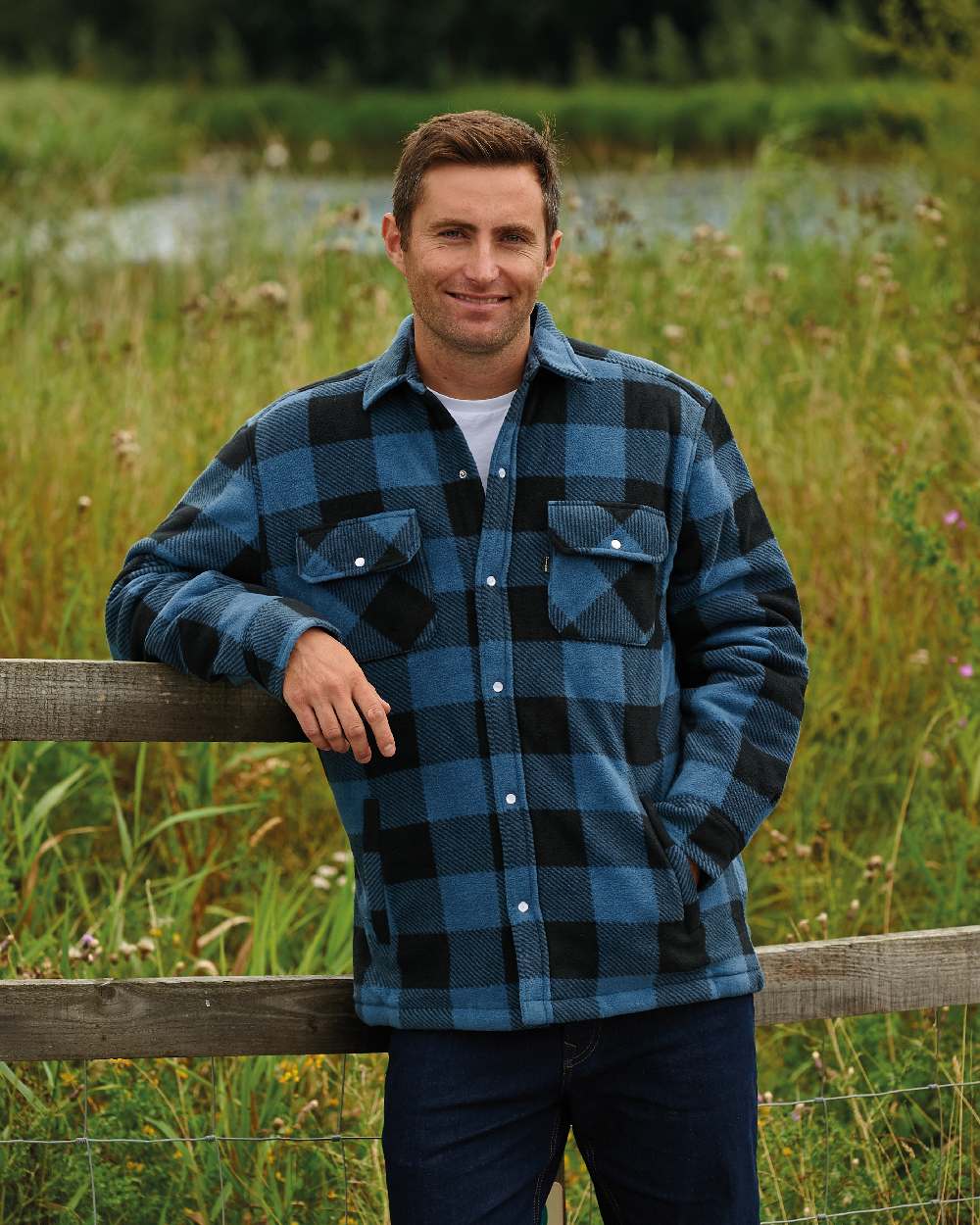 Blue coloured Champion Kinross Padded Fleece Lumberjack Shirt on forest background 