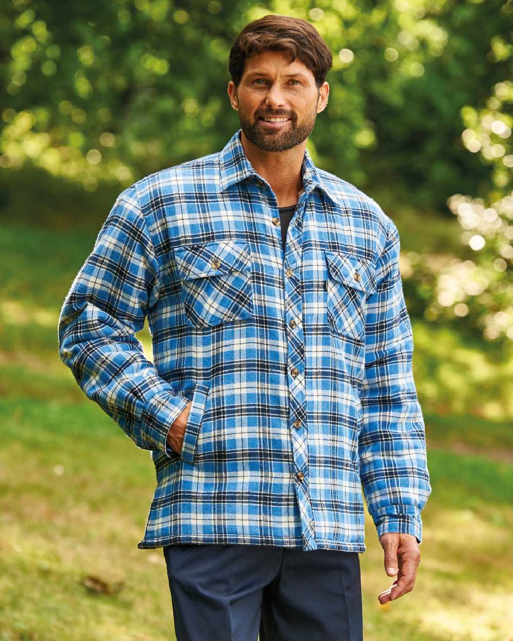 Blue coloured Champion Pennine Fleece Lined Shirt on lawn background 