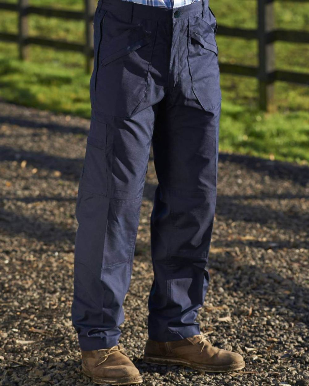 Navy coloured Champion Wenlock Multi Pocket Activity Trousers on forest background 