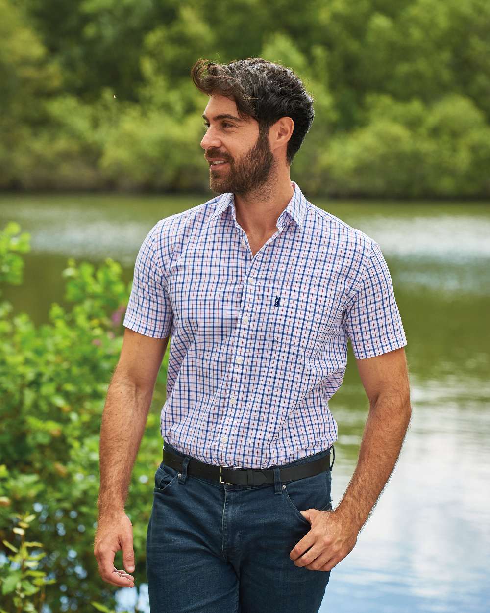 Red coloured Champion Whitstable Short Sleeve Shirt on pond background 