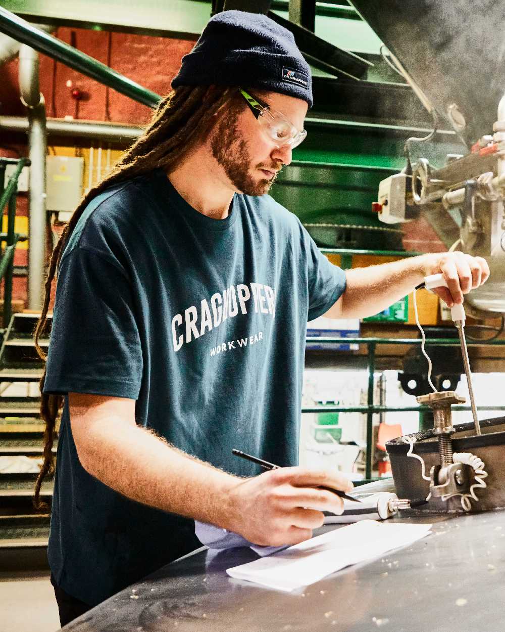 Dark Aegean Blue Coloured Craghoppers Expert Mens Batley Workwear T-Shirt on construction background 