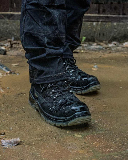 Black Coloured DeWalt Challenger Waterproof Safety Hiker Boots on outdoor background 