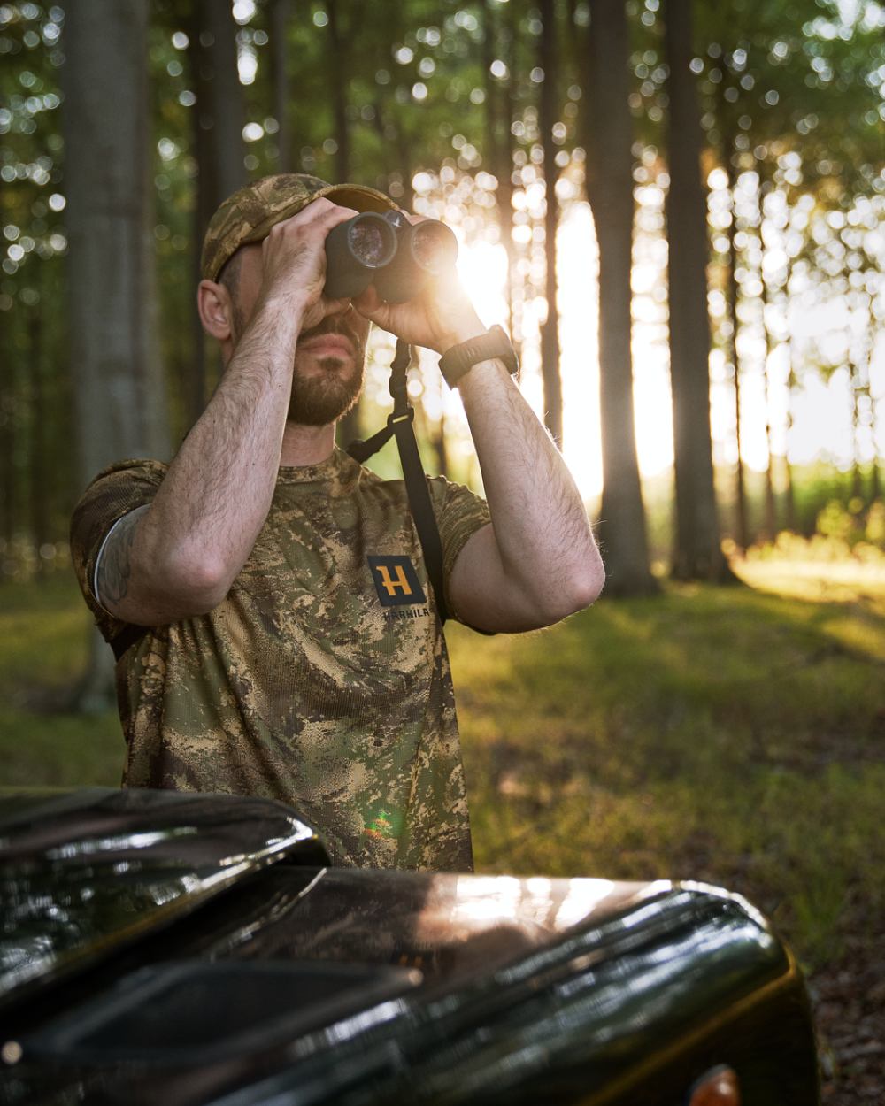 Axis Forest Coloured Harkila Deer Stalker Camo Short Sleeve T-Shirt On A Forest Background