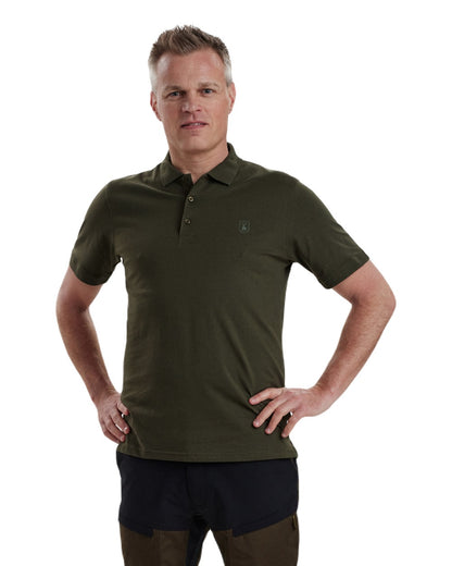 Green coloured Deerhunter Christian Polo Shirt on white background 