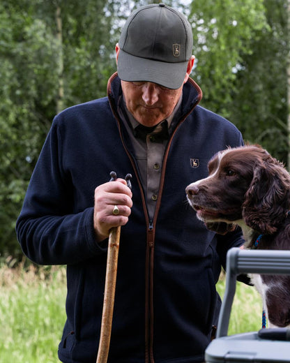 Dark Blue coloured Deerhunter Cumbria Fleece Jacket on forest background 