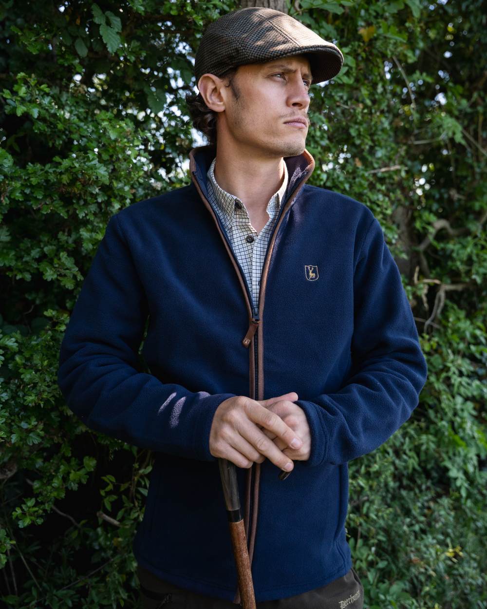 Dark Blue coloured Deerhunter Cumbria Fleece Jacket on tree background 