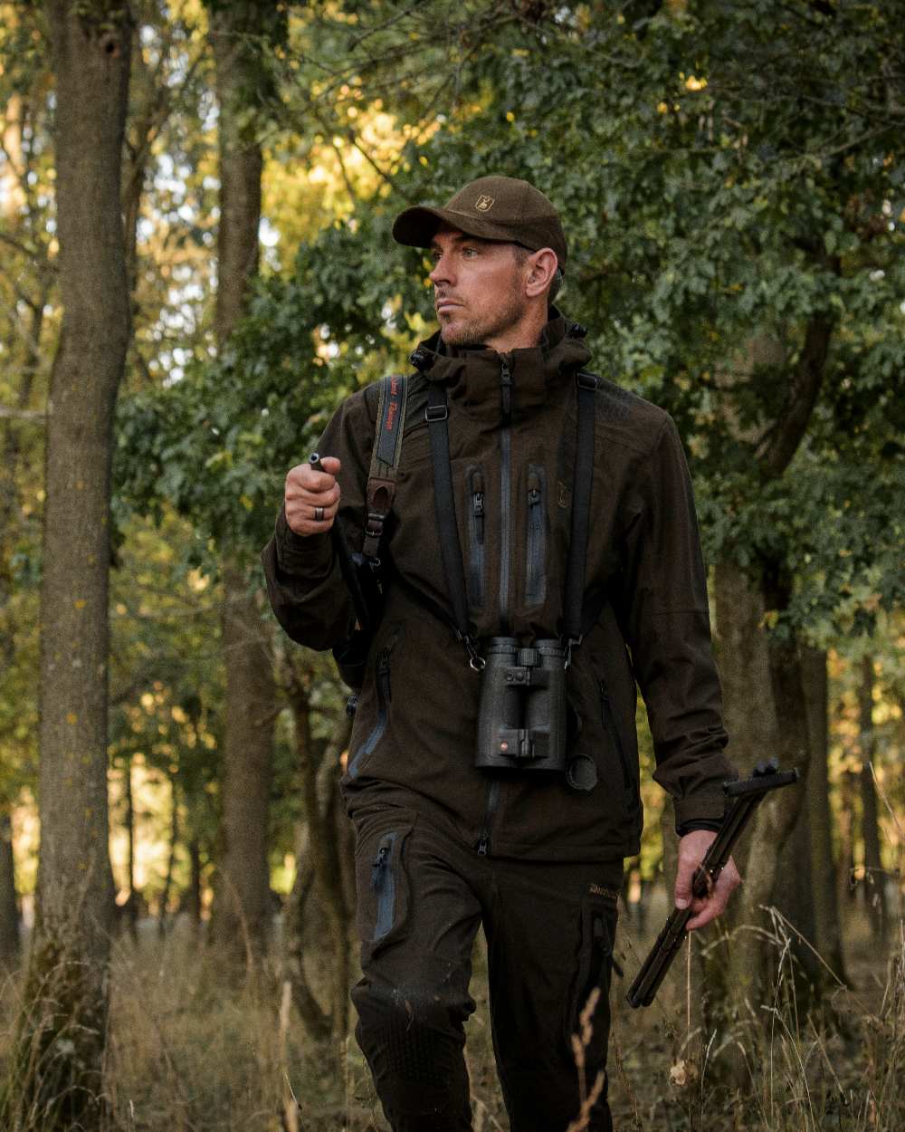 Wood coloured Deerhunter Game Pro Light Jacket on forest background 