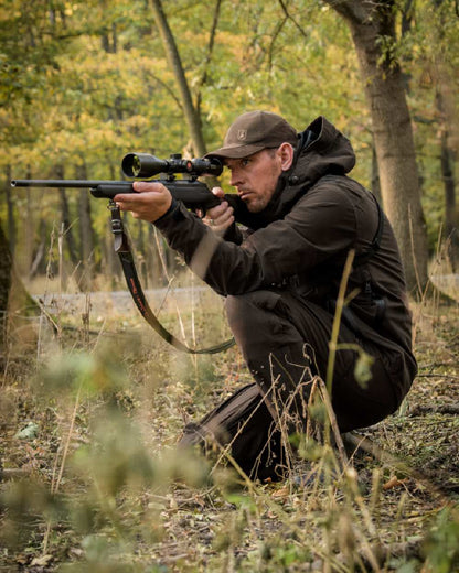 Wood coloured Deerhunter Game Pro Light Trousers on forest background 