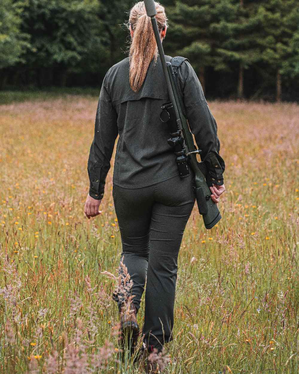 Forest Green coloured Deerhunter Lady Canopy Trousers on grassy background 