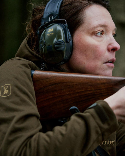 Art Green coloured Deerhunter Lady Excape Softshell Jacket on blurry background 