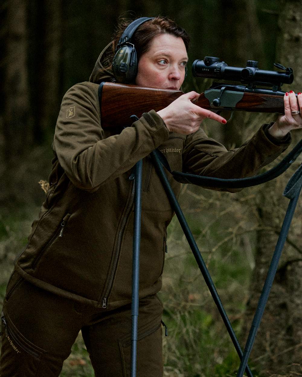 Art Green coloured Deerhunter Lady Excape Softshell Jacket on blurry background 